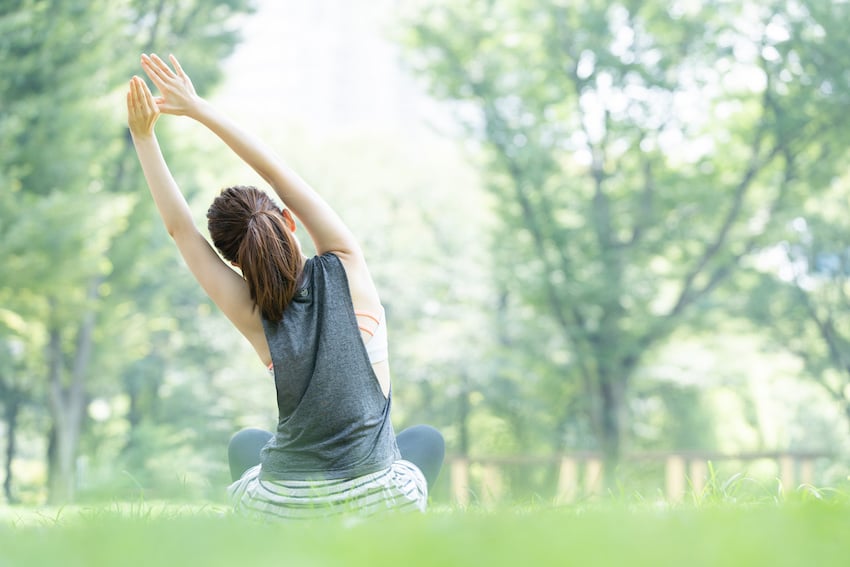 Woman-doing-yoga-park.jpg