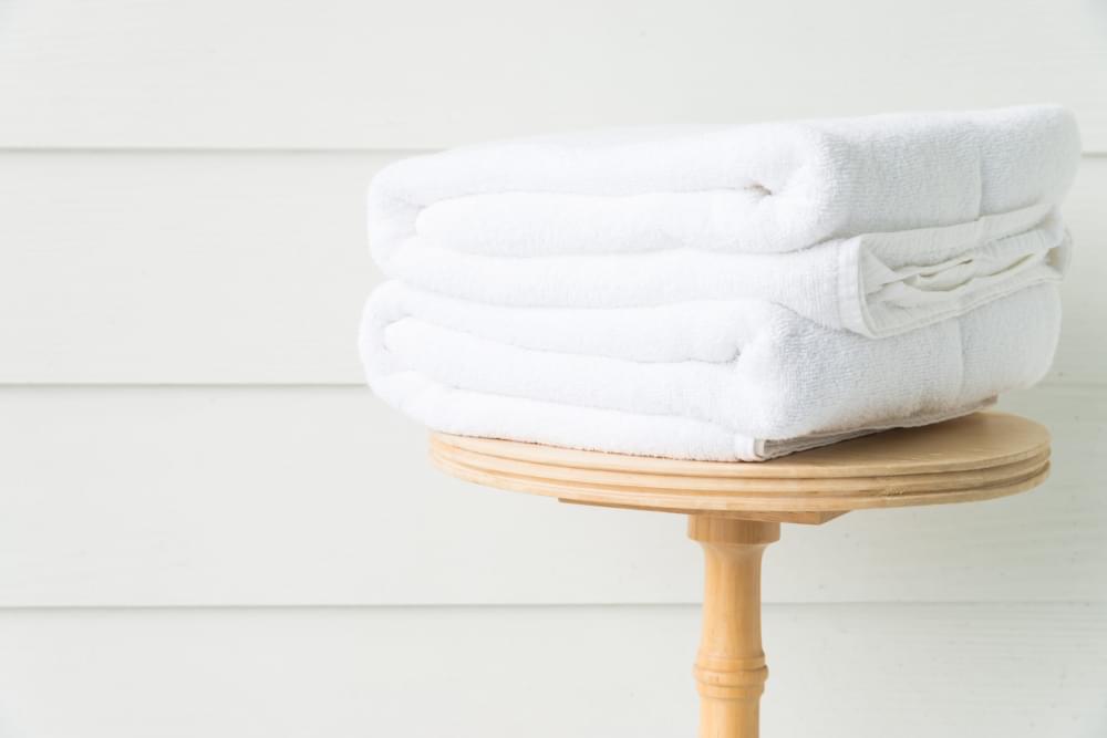 Towel-bath-on-wood-table.jpg