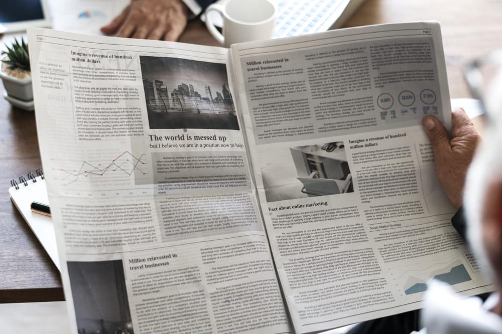 Business-people-reading-newspaper.jpg