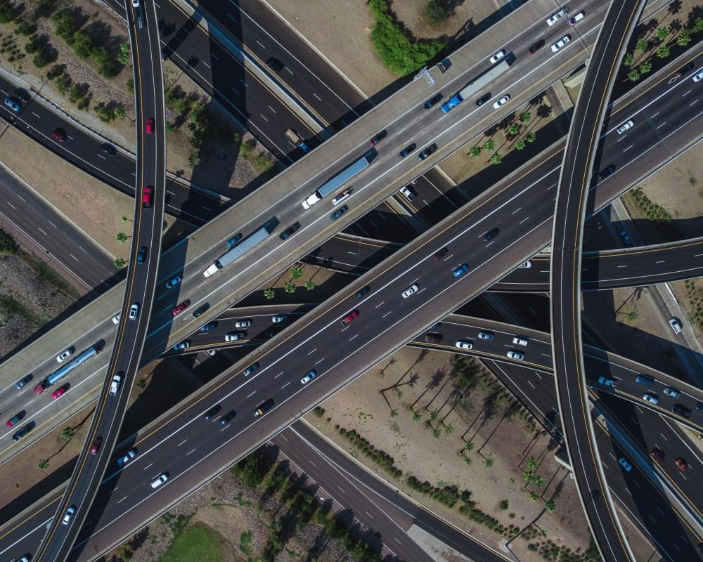 Aerial-view-of-a-busy-highway-intersection-full-of-traffic-during-daytime.jpg