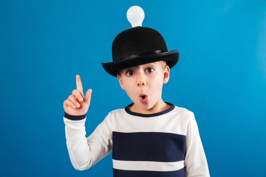 Shocked-young-boy-in-hat-with-lightbulb-having-idea.jpg