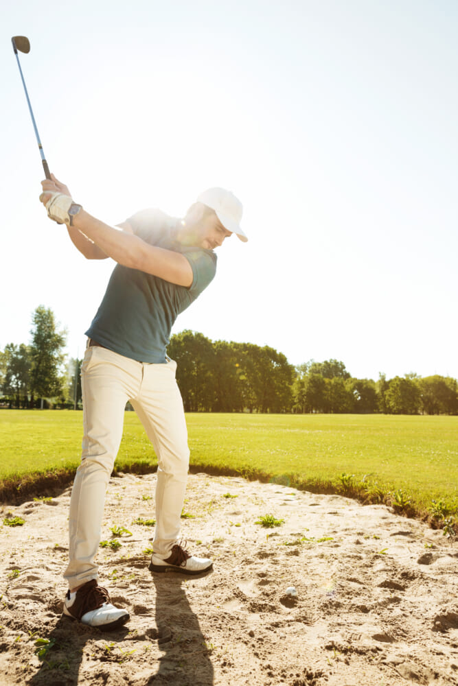 Golfer-about-hit-ball-out-sand-bunker.jpg