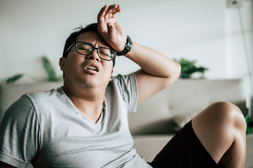 Funny-overweight-man-glasses-closed-his-eyes-lying-exhausted-down-floor-after-workout-copy-space.jpg