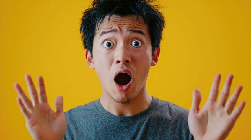 Shocked-asian-male-with-wide-eyes-yellow-background.jpg