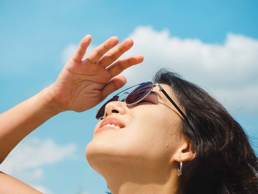 Woman-summertime-smiling-beautiful-asian-woman-short-hair-wearing-sunglasses-white-sleeveless-shirt-looking-up-shading-eyes-with-her-hand-blue-sky-background-sunny-day-summer_36367-1719.jpg