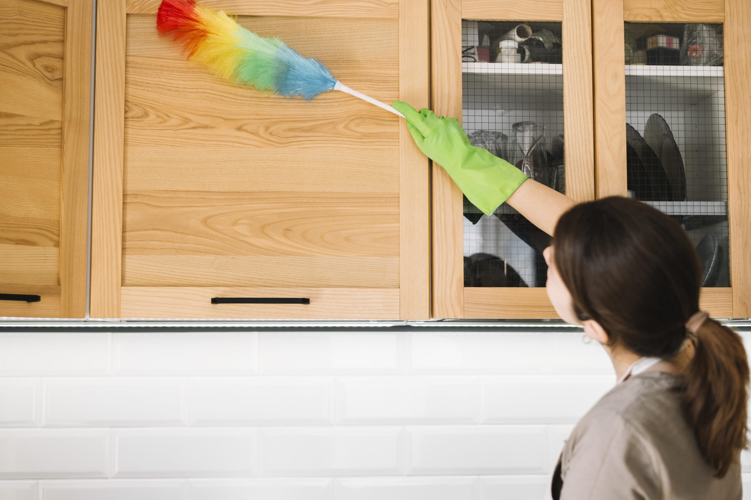 Woman-using-colorful-fluffy-duster.jpg